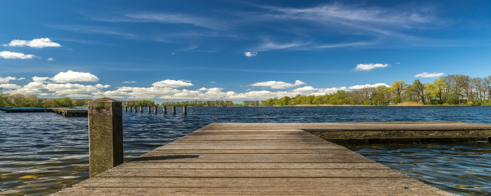 wooden dock sea sunlight blue